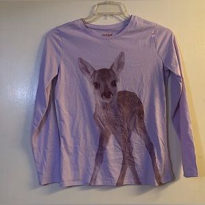 Long sleeve, has picture of deer, purple, has some gold out line in deer